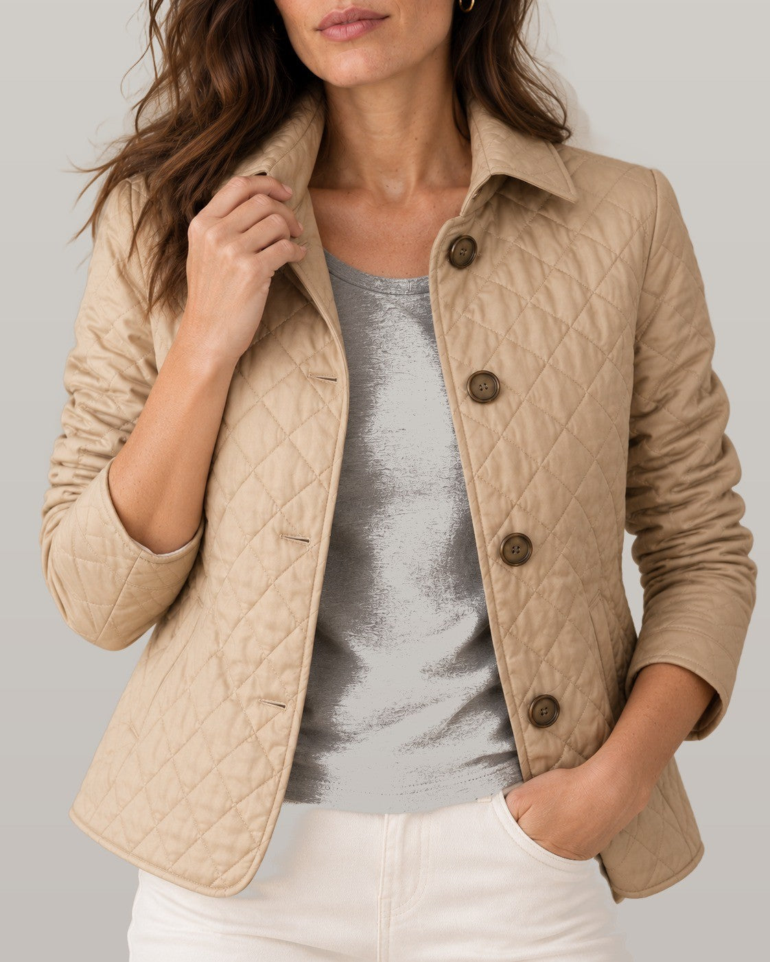 Elegant quilted jacket in beige, close-up detail