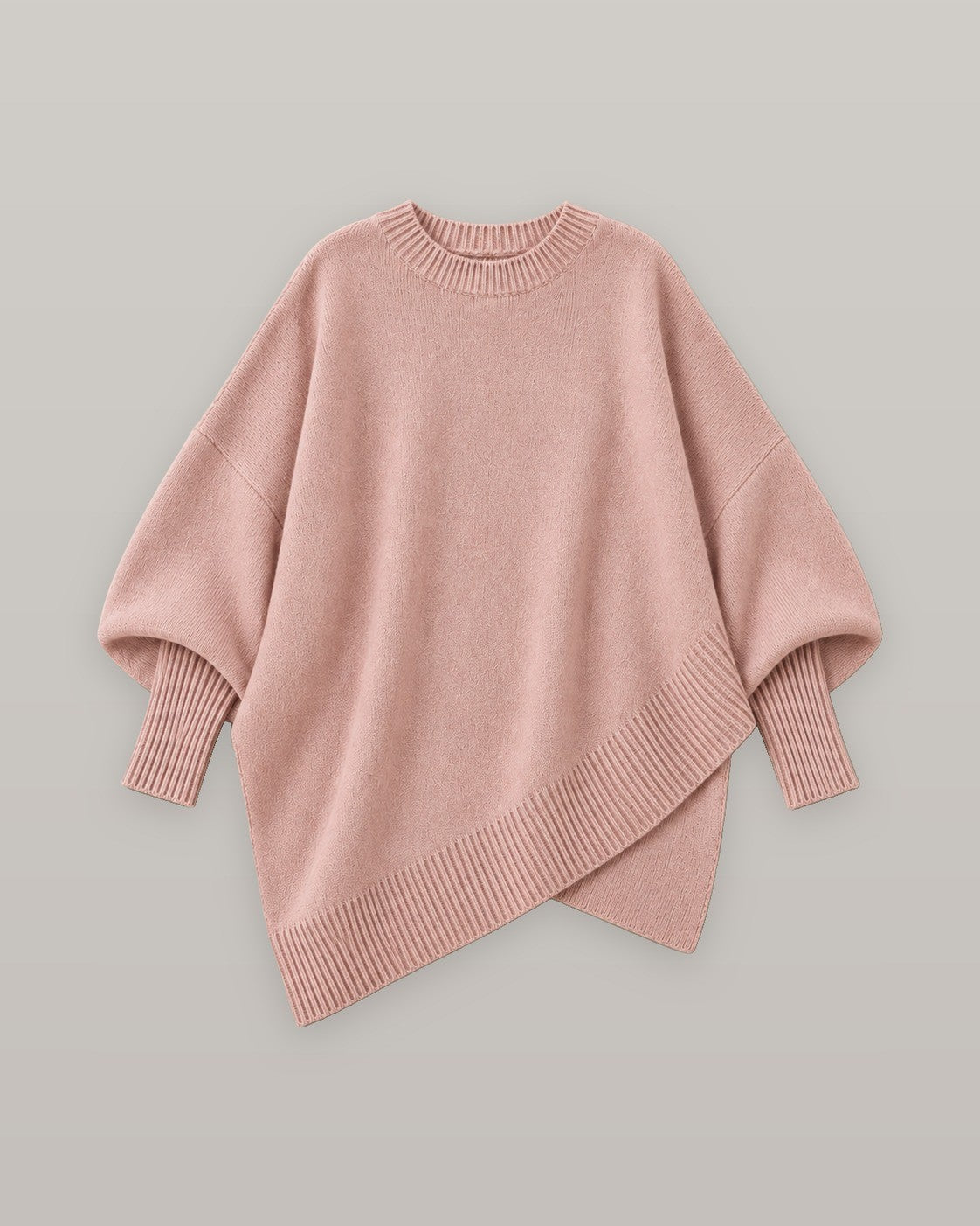 Draped asymmetric knit poncho in pink, flat lay