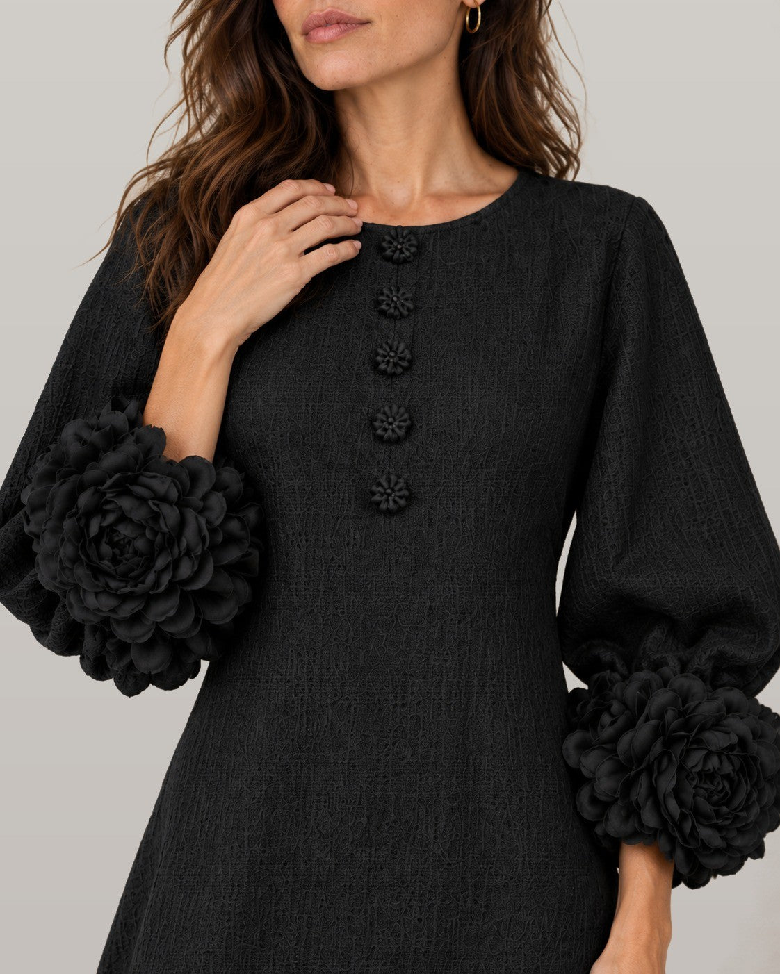 Midi dress with rose-cuff sleeves in black, close-up detail
