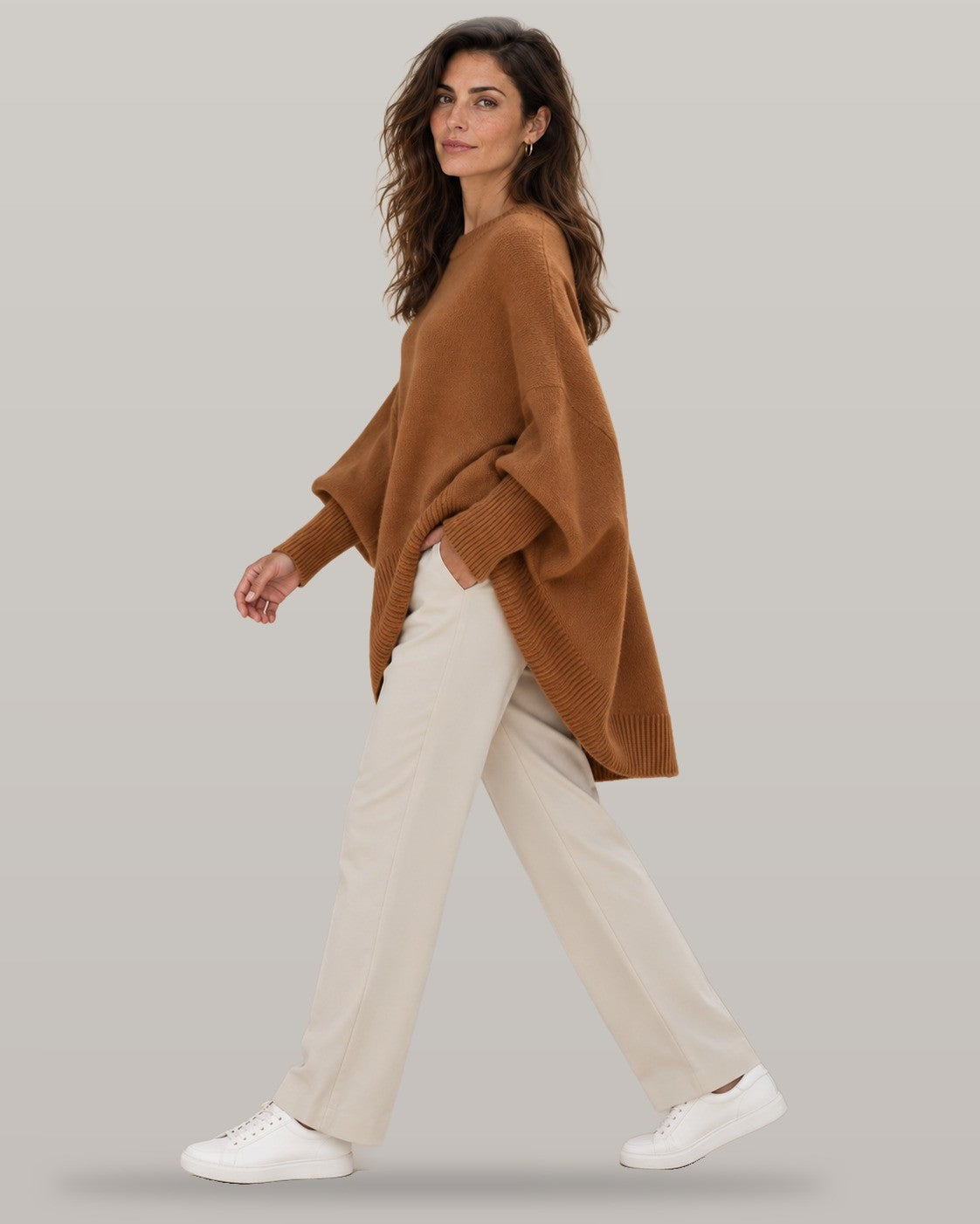 Draped asymmetric knit poncho in brown, full-length view