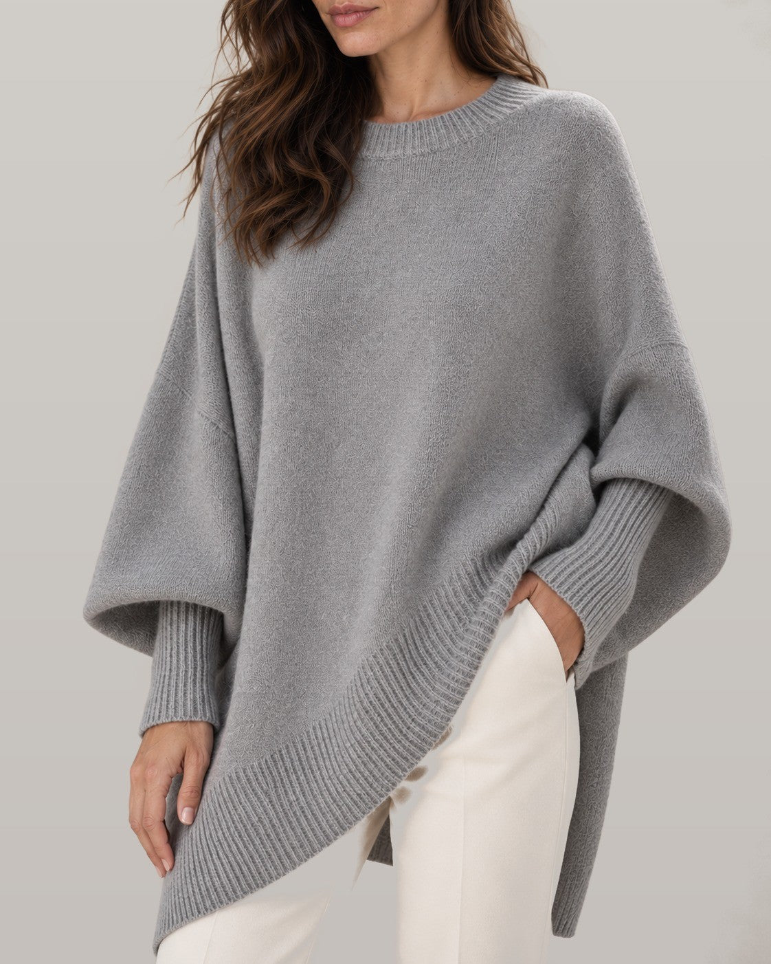 Draped asymmetric knit poncho in gray, close-up detail
