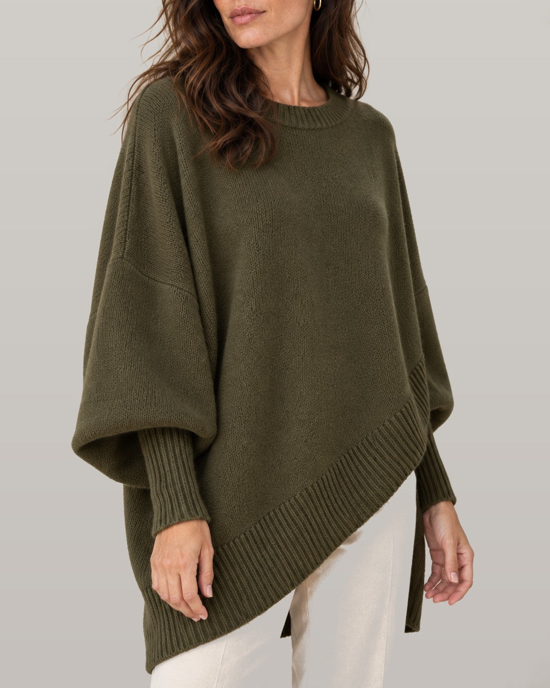 Draped asymmetric knit poncho in dark green, close-up detail