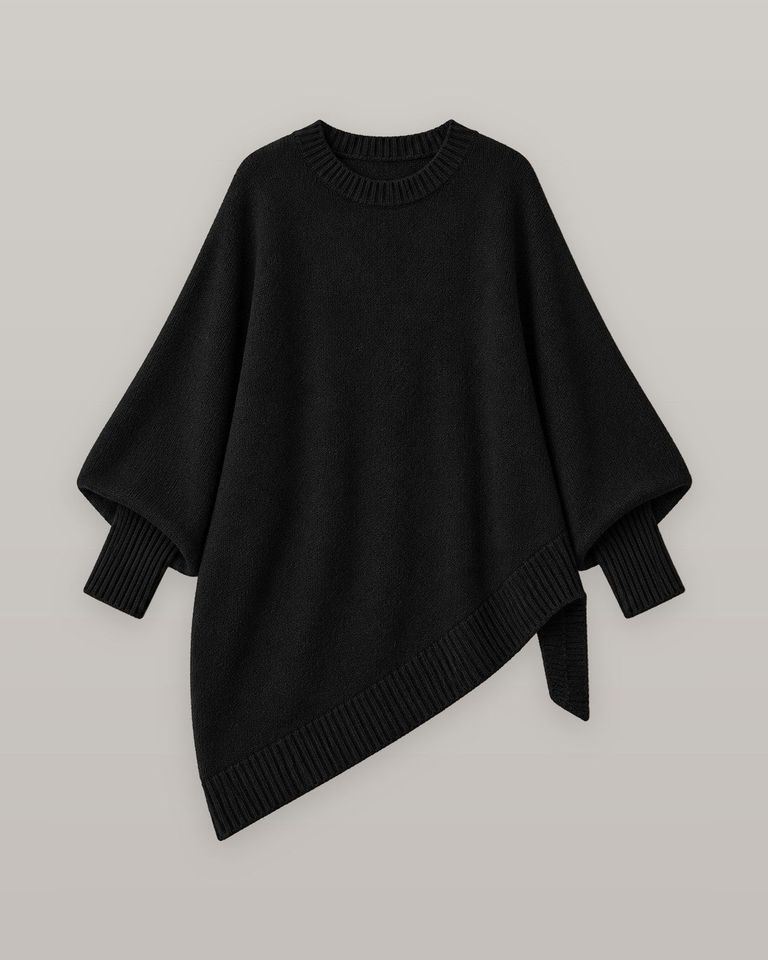 Draped asymmetric knit poncho in black, flat lay